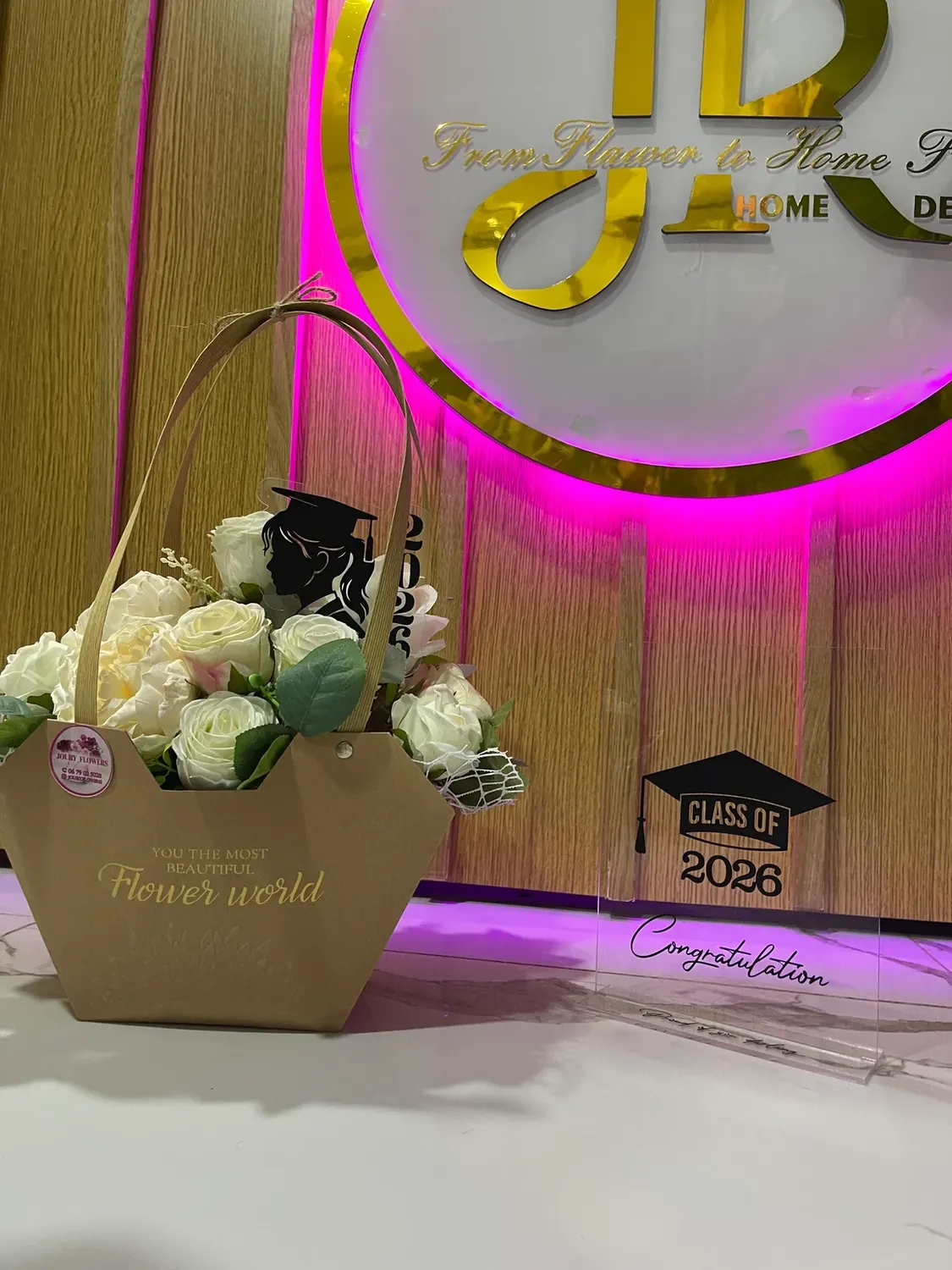Cream graduation bloom bucket by Joury Flowers
